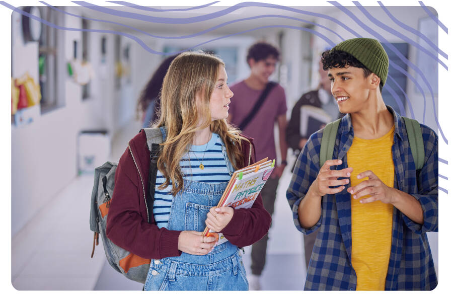 Teens walking in the hallway at school